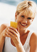 woman drinking orange juice